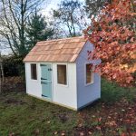 Handmade children’s playhouse with custom colours - installed in the garden - Artisan Deco - Made in the UK