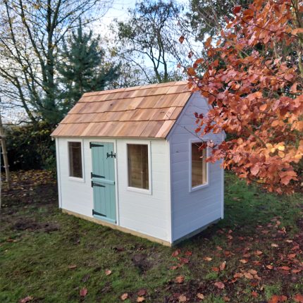 Handmade children’s playhouse with custom colours - installed in the garden - Artisan Deco - Made in the UK